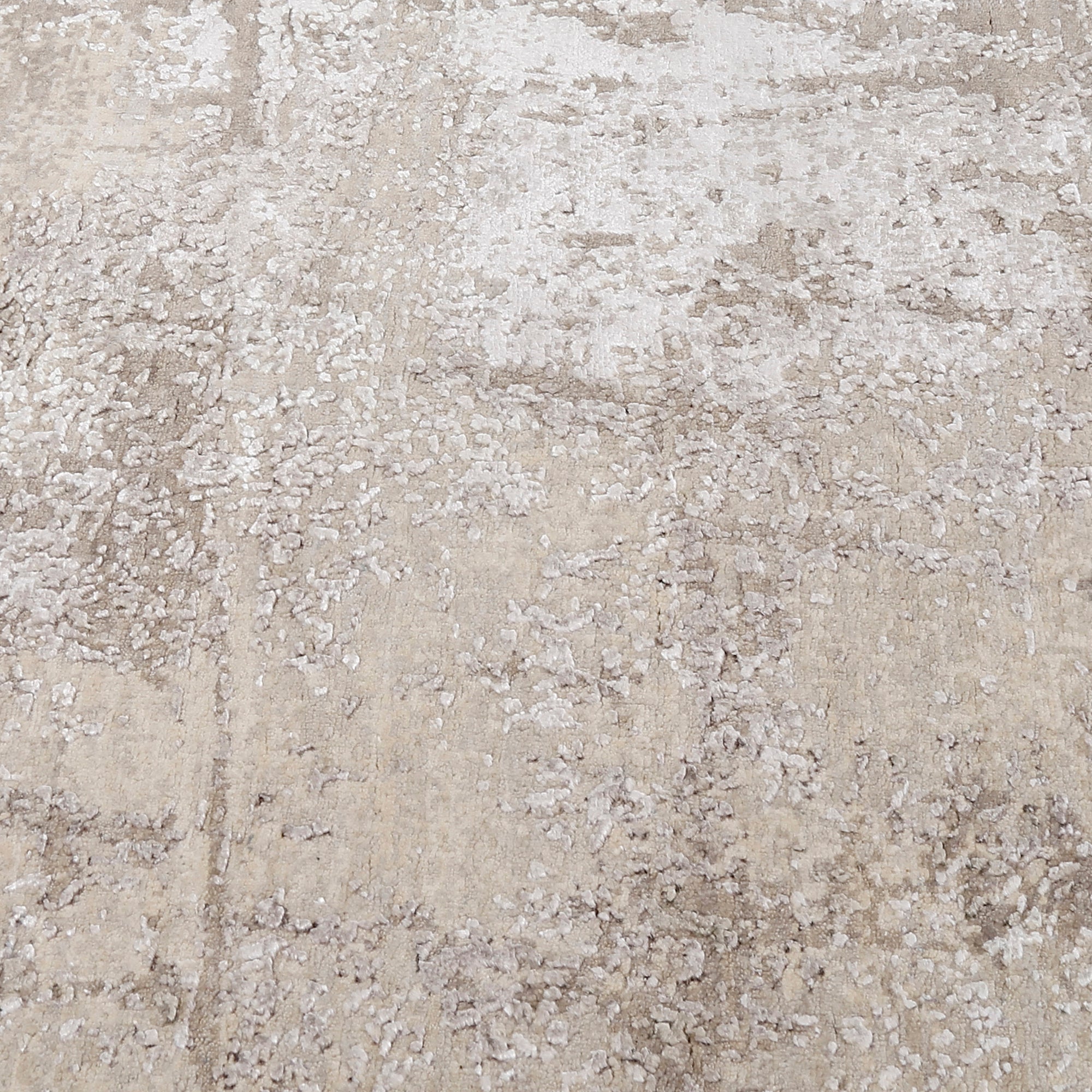 Close-up of the hand knotted wool and viscose texture with ivory beige greige and taupe abstract detailing