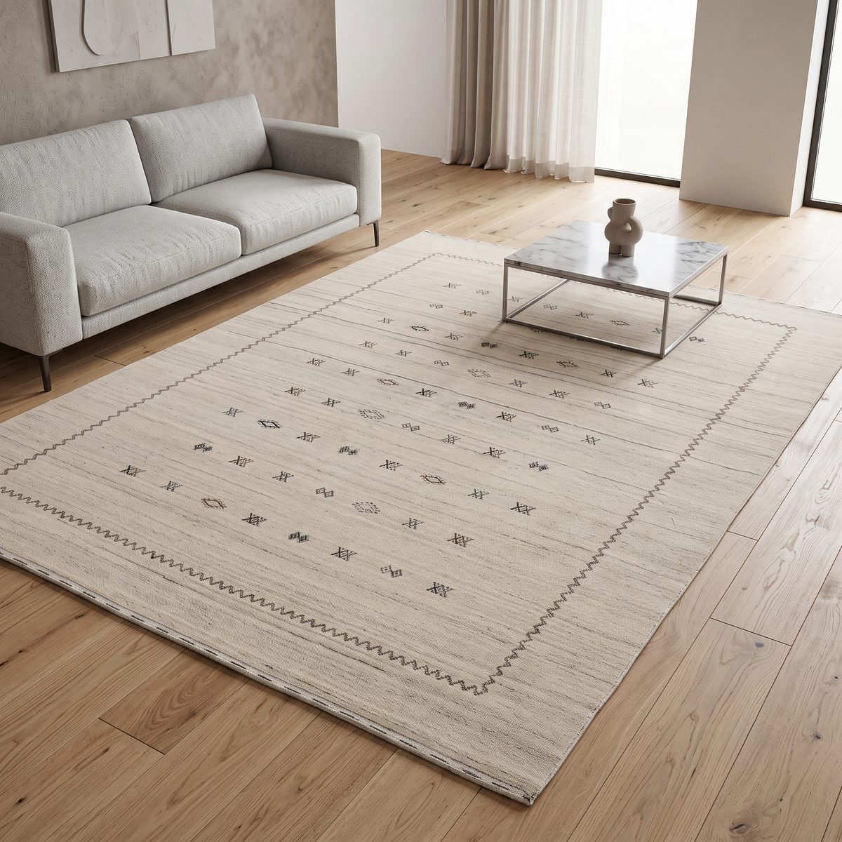 Ivory Hand Woven Loom Lori wool rug with scattered geometric tribal motifs and zigzag border styled in a neutral living room