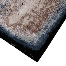 Dark hand-finished border and distressed surface of the Ivory Shadow hand knotted modern runner rug