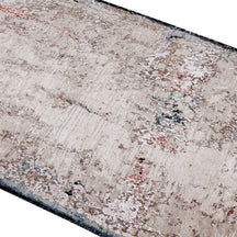 Close-up of Ivory Shadow hand knotted runner rug texture with ivory beige grey blue and rust abstract detailing