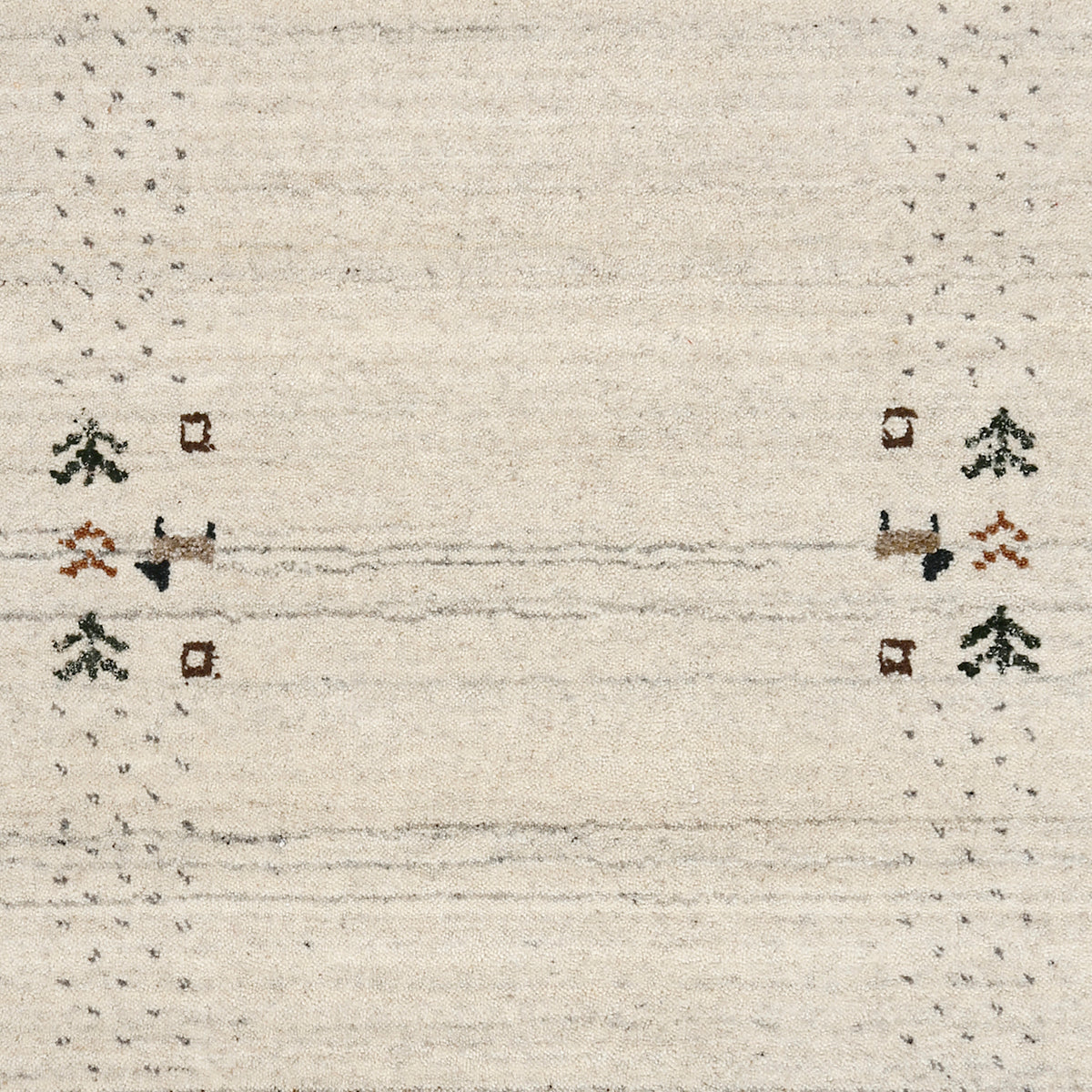 Close-up of ivory Hand Woven Loom Lori wool rug showing natural wool texture, grey striations and earthy folk motifs