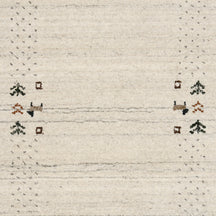 Close-up of ivory Hand Woven Loom Lori wool rug showing natural wool texture, grey striations and earthy folk motifs