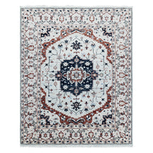 Full view of ivory hand knotted traditional wool rug with navy blue central medallion