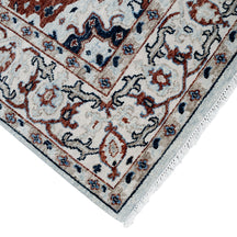 Khushi Living hand knotted traditional wool rug in ivory with classic medallion pattern