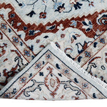 Khushi Living hand knotted traditional wool rug in ivory with classic medallion pattern