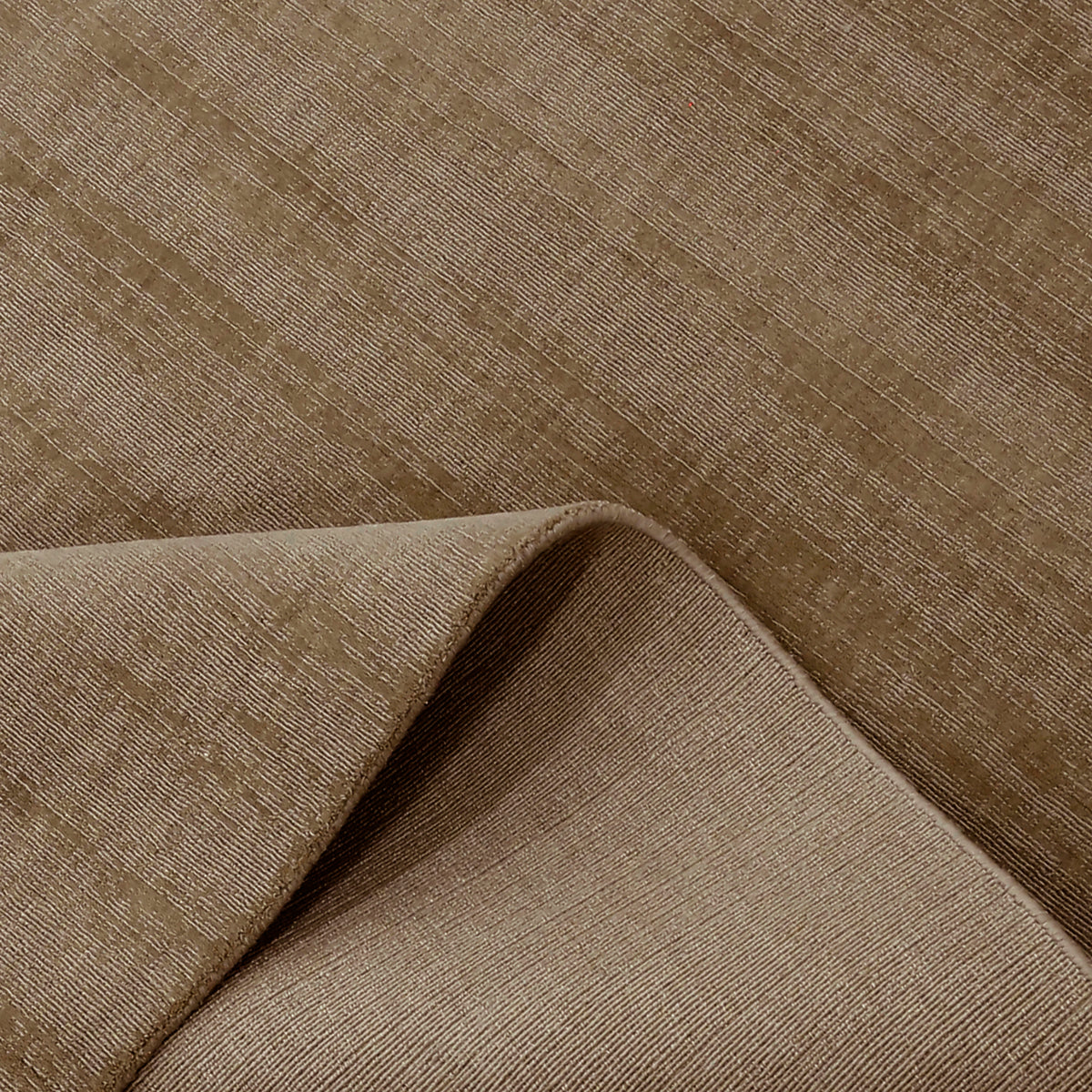 Close-up of Light Beige Loom Lori wool rug showing the woven surface, finished edge and underside construction.