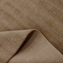 Close-up of Light Beige Loom Lori wool rug showing the woven surface, finished edge and underside construction.