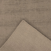 Close-up underside view of Light Beige Loom Lori runner wool rug showing the woven backing, finished edge and handcrafted construction.