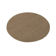 Angled view of Light Beige Round Hand Woven Loom Lori wool rug showing its circular shape and subtle woven texture.