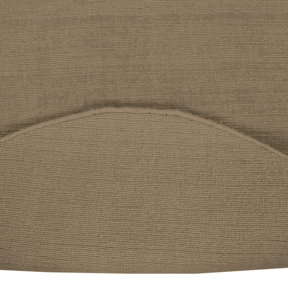 Close-up underside view of Light Beige Round Loom Lori wool rug showing the woven backing, finished edge and handcrafted construction.