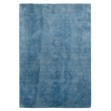 Full view of light blue rectangular hand woven Loom Lori wool rug featuring a clean plain design and soft tonal variations.