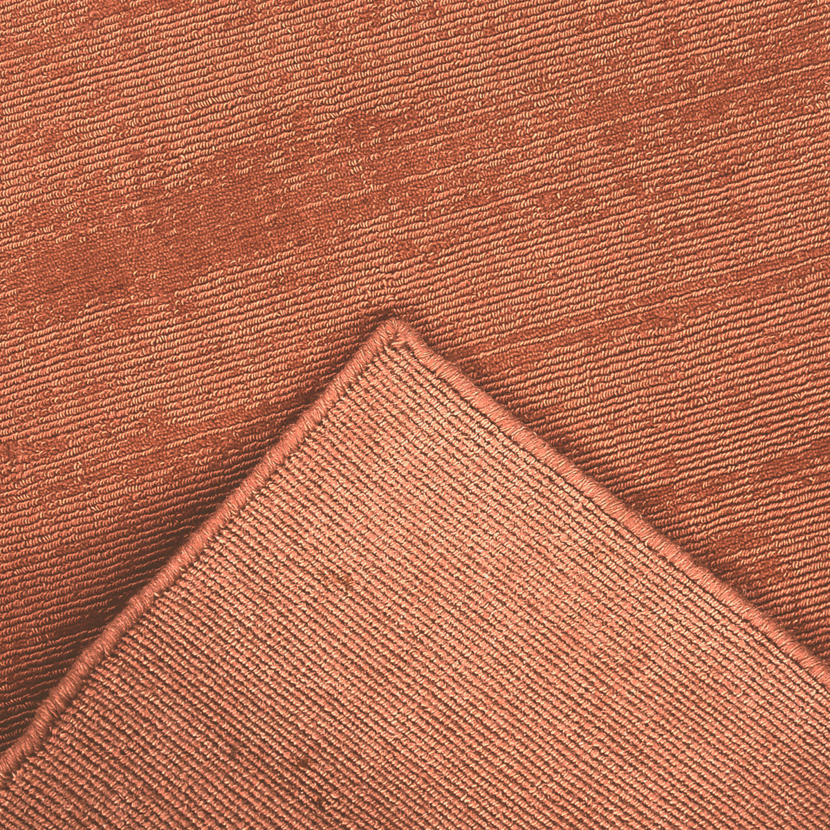 Back and edge detail of light pink Hand Woven Loom Lori wool runner rug showing its woven underside, finished border and handcrafted construction.