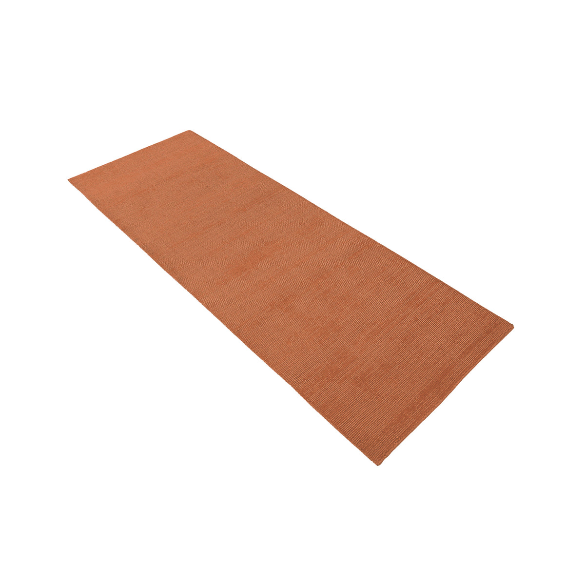Side angle view of light pink Hand Woven Loom Lori wool runner rug showing its long rectangular shape, plain surface and subtle linear texture.