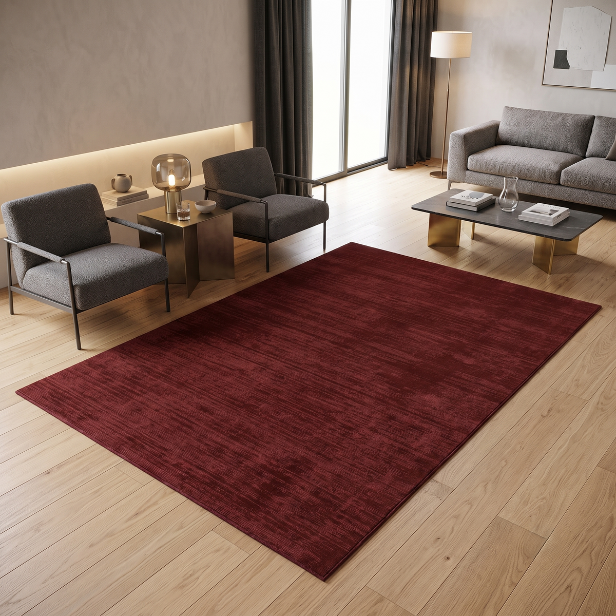Maroon Hand Woven Loom Lori wool rug styled in a contemporary living room with grey seating, wooden flooring and warm metallic accents.