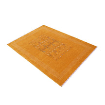 Side angle view of mustard yellow Hand Woven Loom Lori wool rug highlighting wool texture, tribal geometric pattern and handmade finish