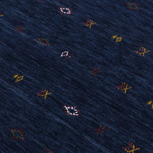 Close-up of navy blue Hand Woven Loom Lori wool rug showing natural wool texture and multicolour tribal geometric motifs