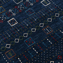 Close-up texture of navy blue Hand Woven Loom Lori wool rug showing natural wool fibres and intricate tribal motif details