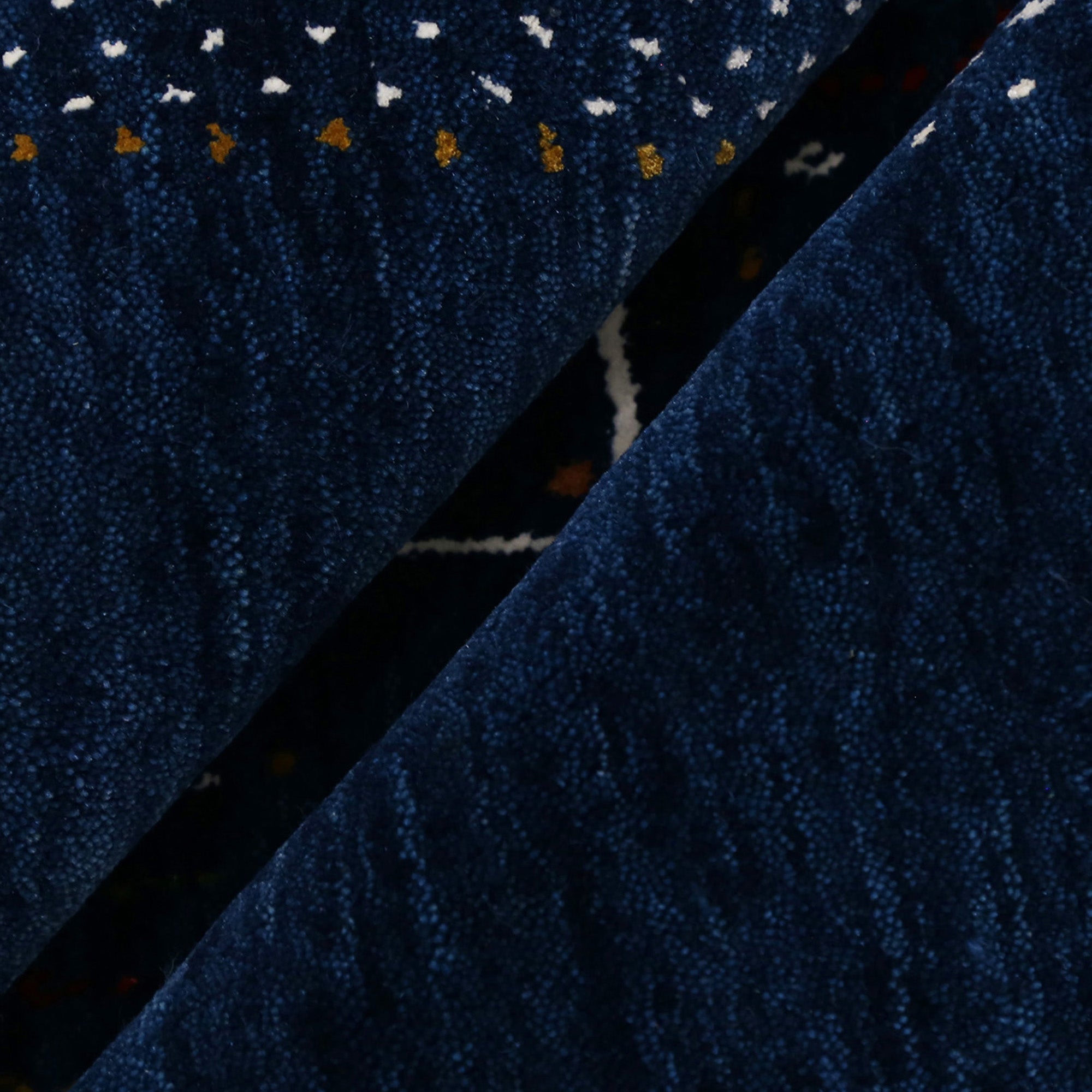 Close-up texture of navy blue Hand Woven Loom Lori wool rug showing natural wool fibres and intricate tribal motif details