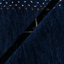 Close-up texture of navy blue Hand Woven Loom Lori wool rug showing natural wool fibres and intricate tribal motif details