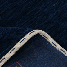Close-up of navy blue Hand Woven Loom Lori wool rug showing natural wool texture and intricate symbolic tribal detailing