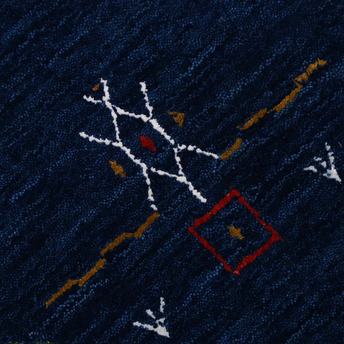 Close-up of navy blue Hand Woven Loom Lori wool rug showing natural wool texture and intricate symbolic tribal detailing