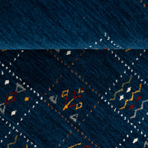Close-up of deep navy blue Hand Woven Loom Lori wool rug showing dotted grid panels and multicolour tribal motifs