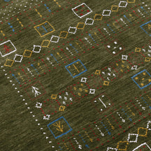 Close-up texture of Hand Woven Loom Lori wool rug showing olive green wool fibres and multicolour geometric motifs