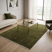 Olive green Hand Woven Loom Lori wool rug with minimal tribal border styled in an earthy contemporary living room