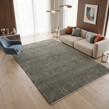 Olive grey Hand Woven Loom Lori wool rug with central diamond tribal medallion styled in a sophisticated neutral living room