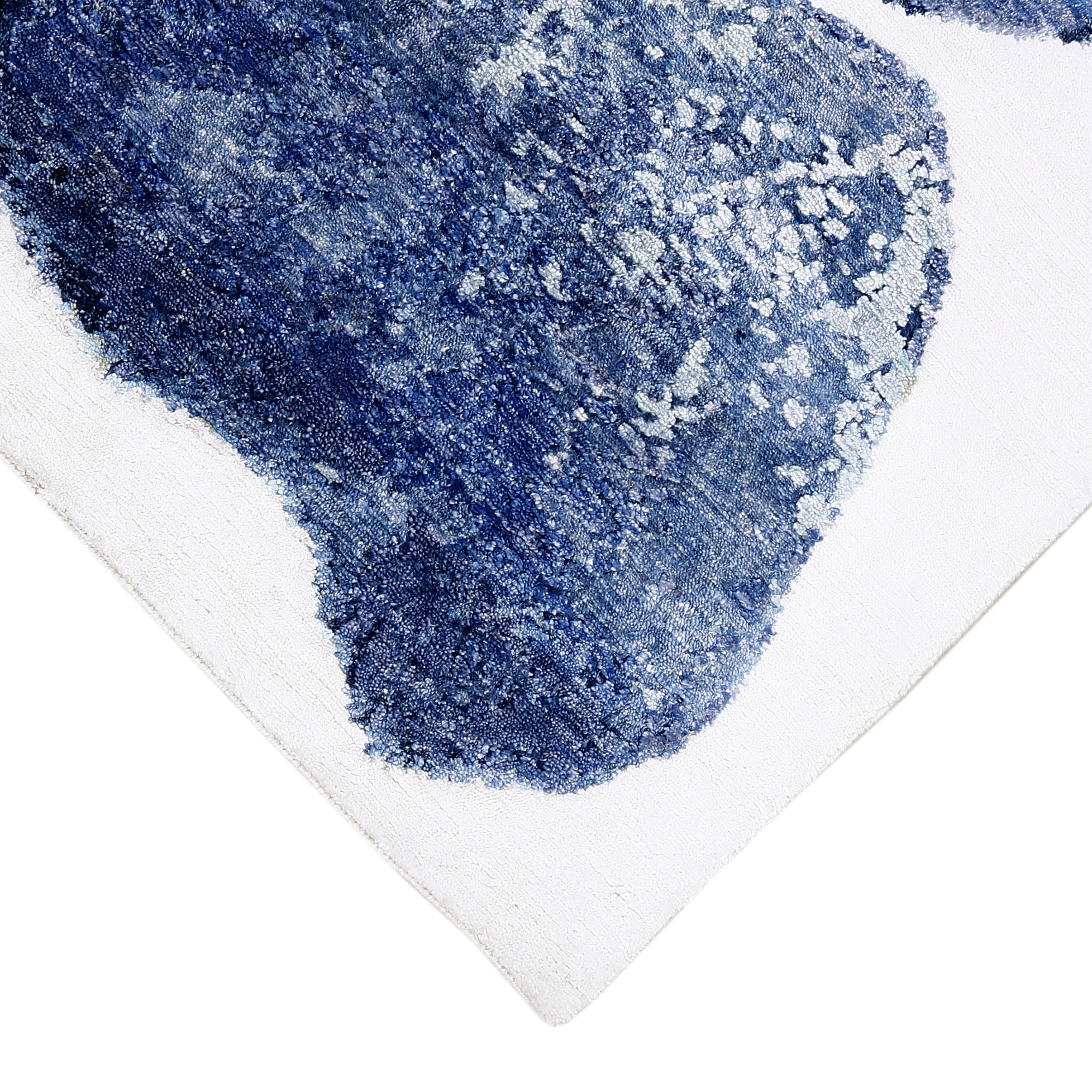 Hand-finished edge and multicolour abstract surface of the Pastel Bloom hand knotted viscose rug