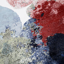 Close-up of Pastel Bloom hand knotted viscose rug with pink blue green red and navy abstract detailing