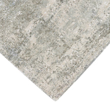 Hand-finished edge and subtle distressed detailing of the pearl mist abstract hand knotted rug