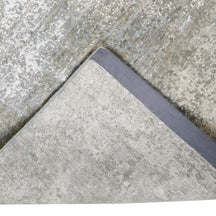 Hand-finished edge and subtle distressed detailing of the pearl mist abstract hand knotted rug