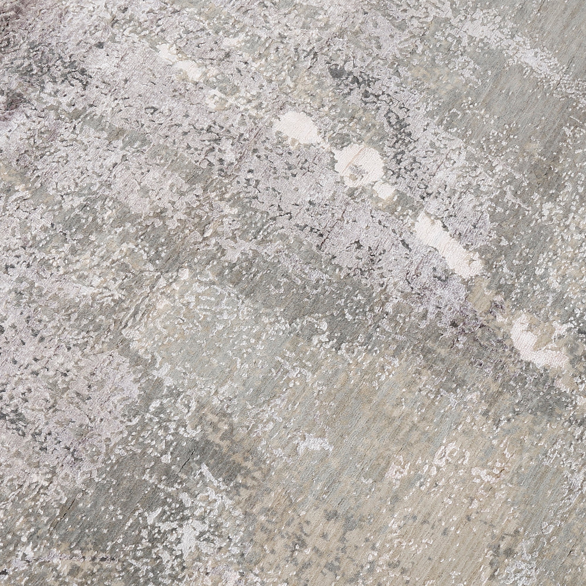 Close-up of the hand knotted wool and viscose texture with ivory beige taupe and silver grey abstract detailing