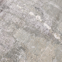 Close-up of the hand knotted wool and viscose texture with ivory beige taupe and silver grey abstract detailing