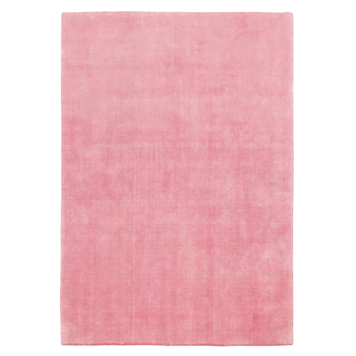 Full view of pink rectangular hand woven Loom Lori wool rug featuring a clean plain design and soft tonal variations.