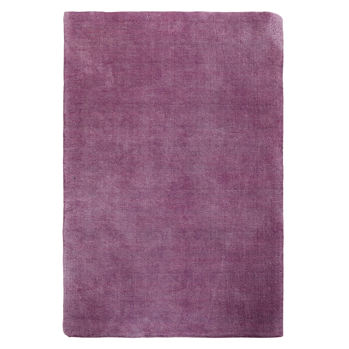 Full view of purple rectangular hand woven Loom Lori wool rug featuring a clean plain design and rich purple colour.