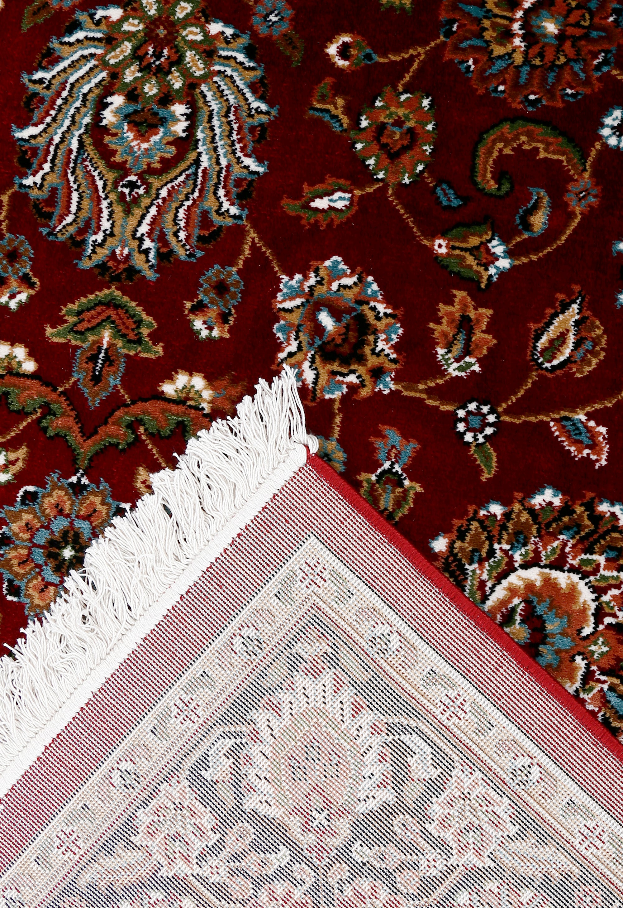 Corner and fringed edge detail of Red Floral Machine Woven Classic Art Silk Rug with black floral border