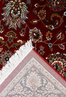 Corner and fringed edge detail of Red Floral Machine Woven Classic Art Silk Rug with black floral border