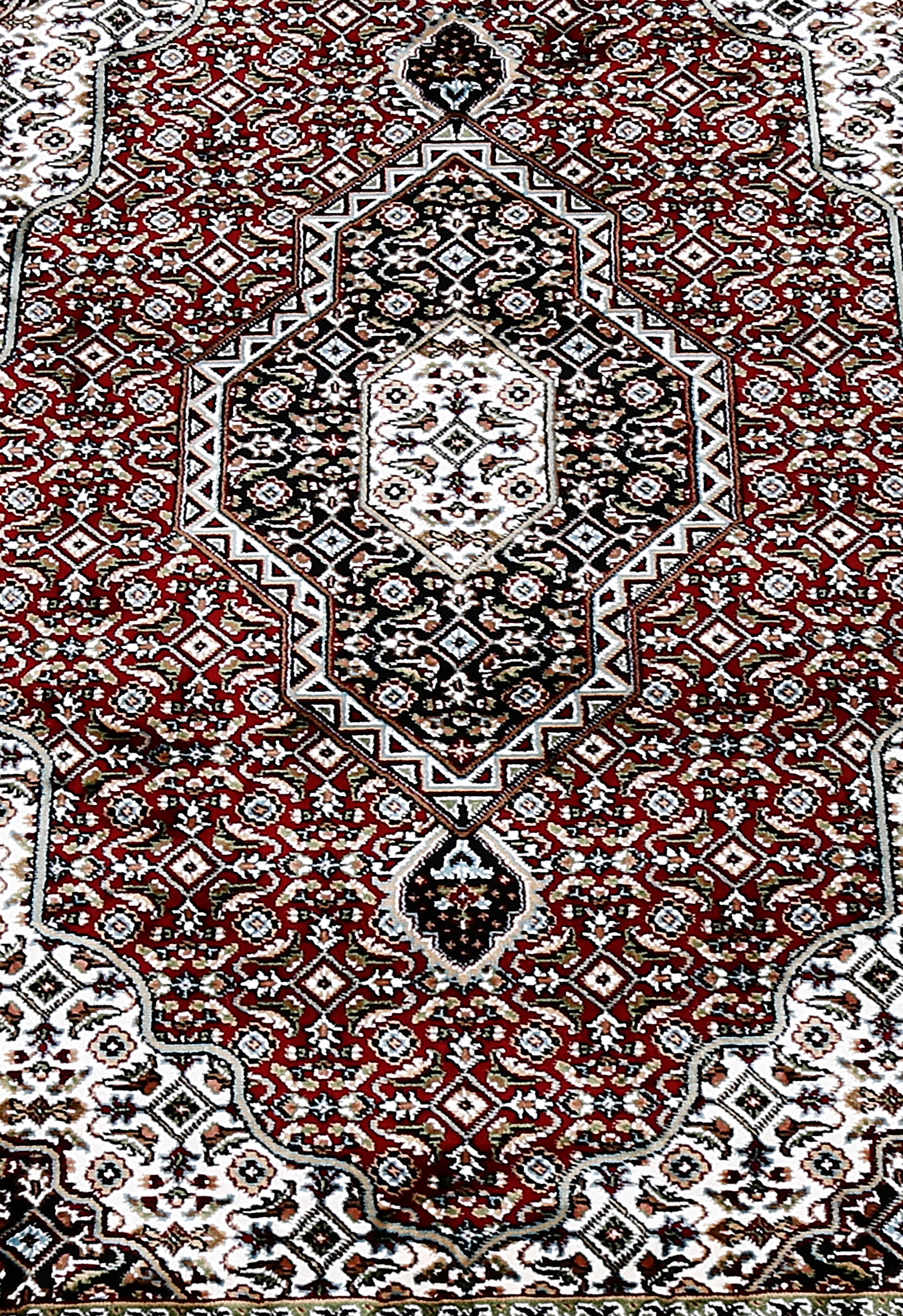 Close-up texture of Red Machine Woven Classic Art Silk Rug showing geometric motifs and smooth Art Silk surface