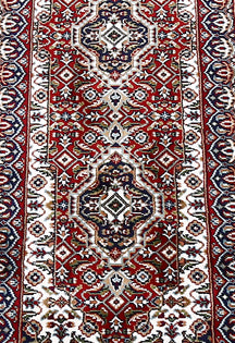 Close-up texture of Red Machine Woven Classic Art Silk Runner Rug showing geometric motifs and smooth Art Silk surface