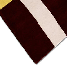 Close-up texture of the red hat lady hand tufted wool wall rug