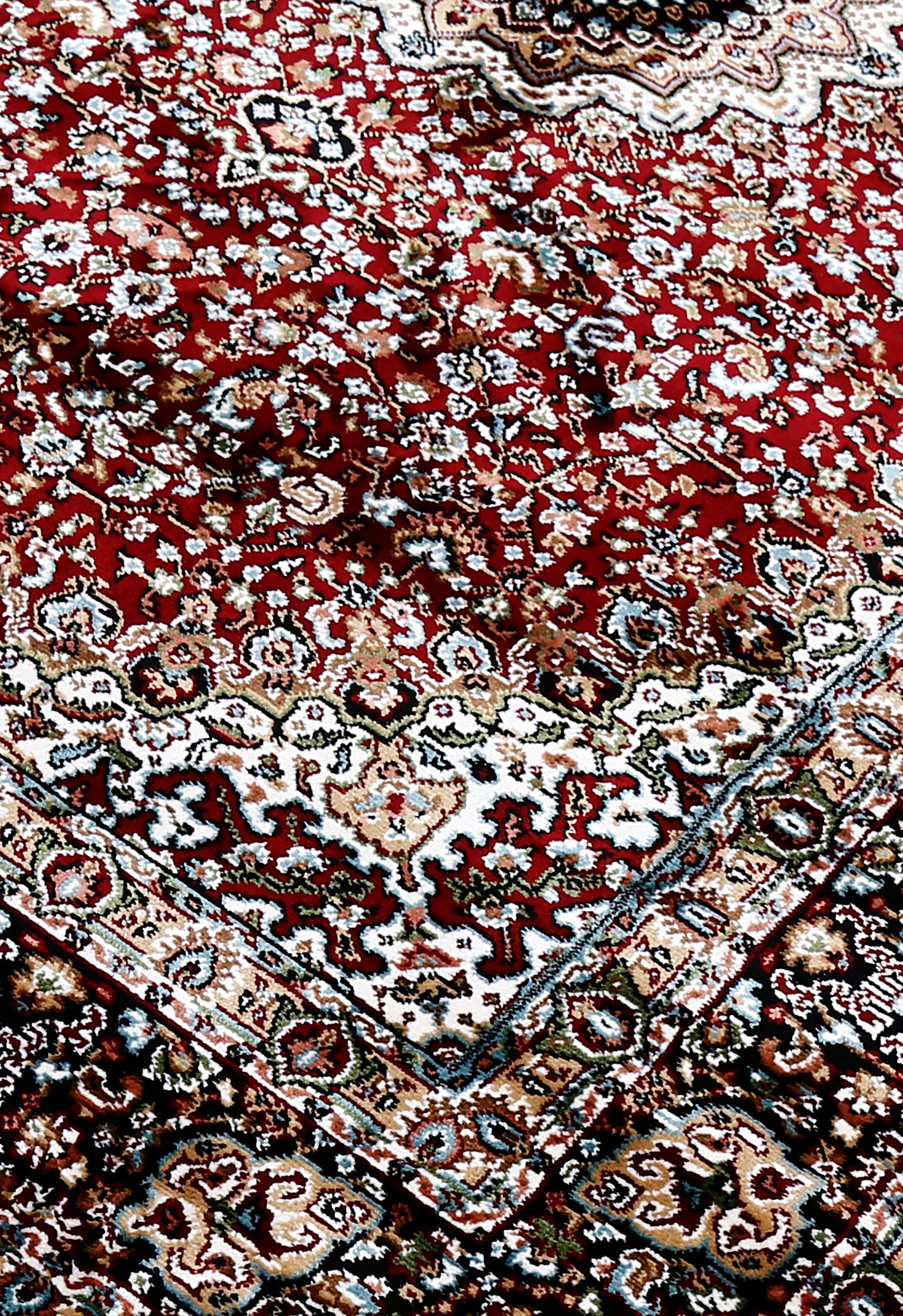 Close-up texture of Red Machine Woven Classic Art Silk Rug showing intricate floral detailing and smooth surface