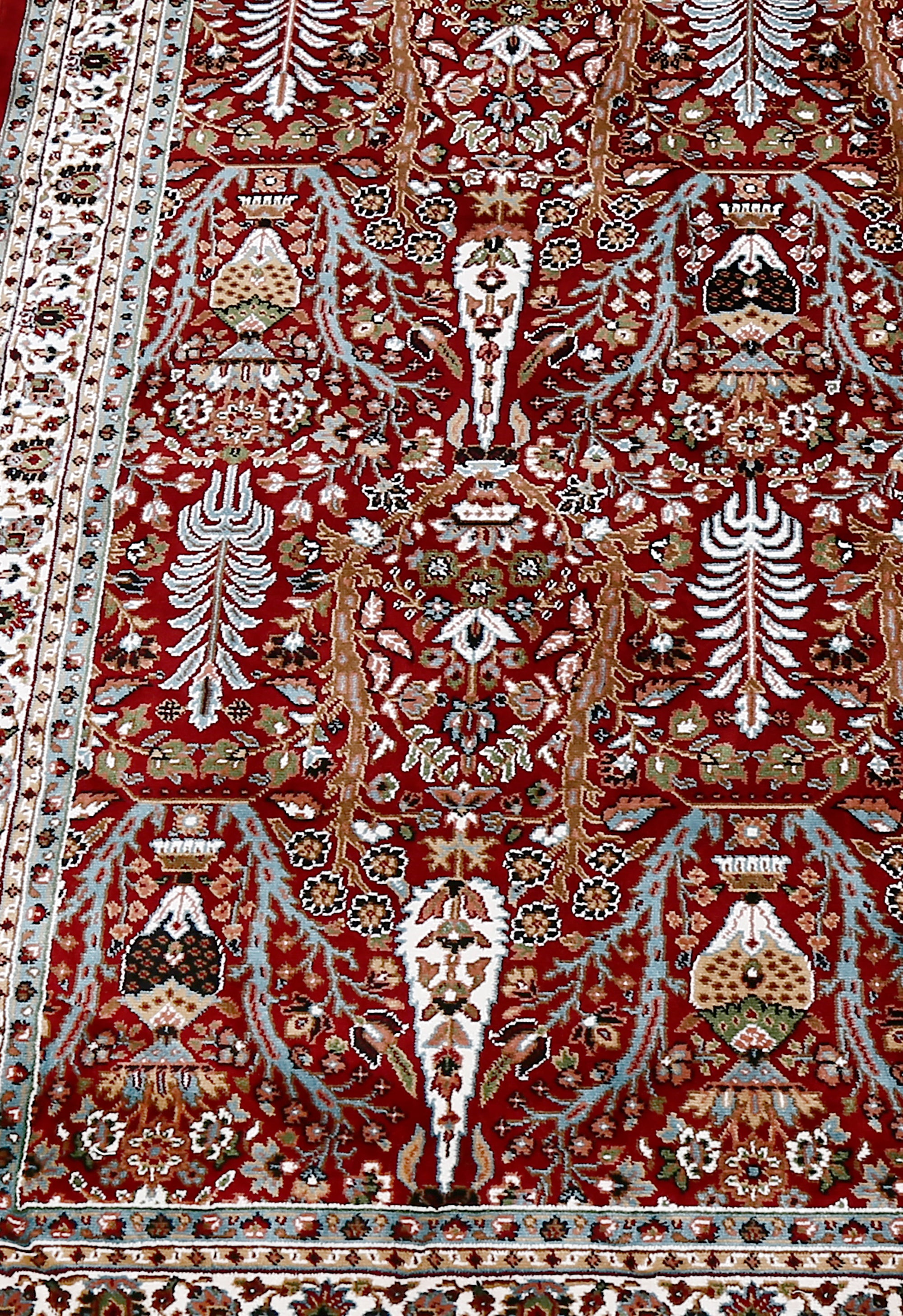 Close-up texture of Red Machine Woven Classic Art Silk Rug showing detailed Tree of Life and floral motifs