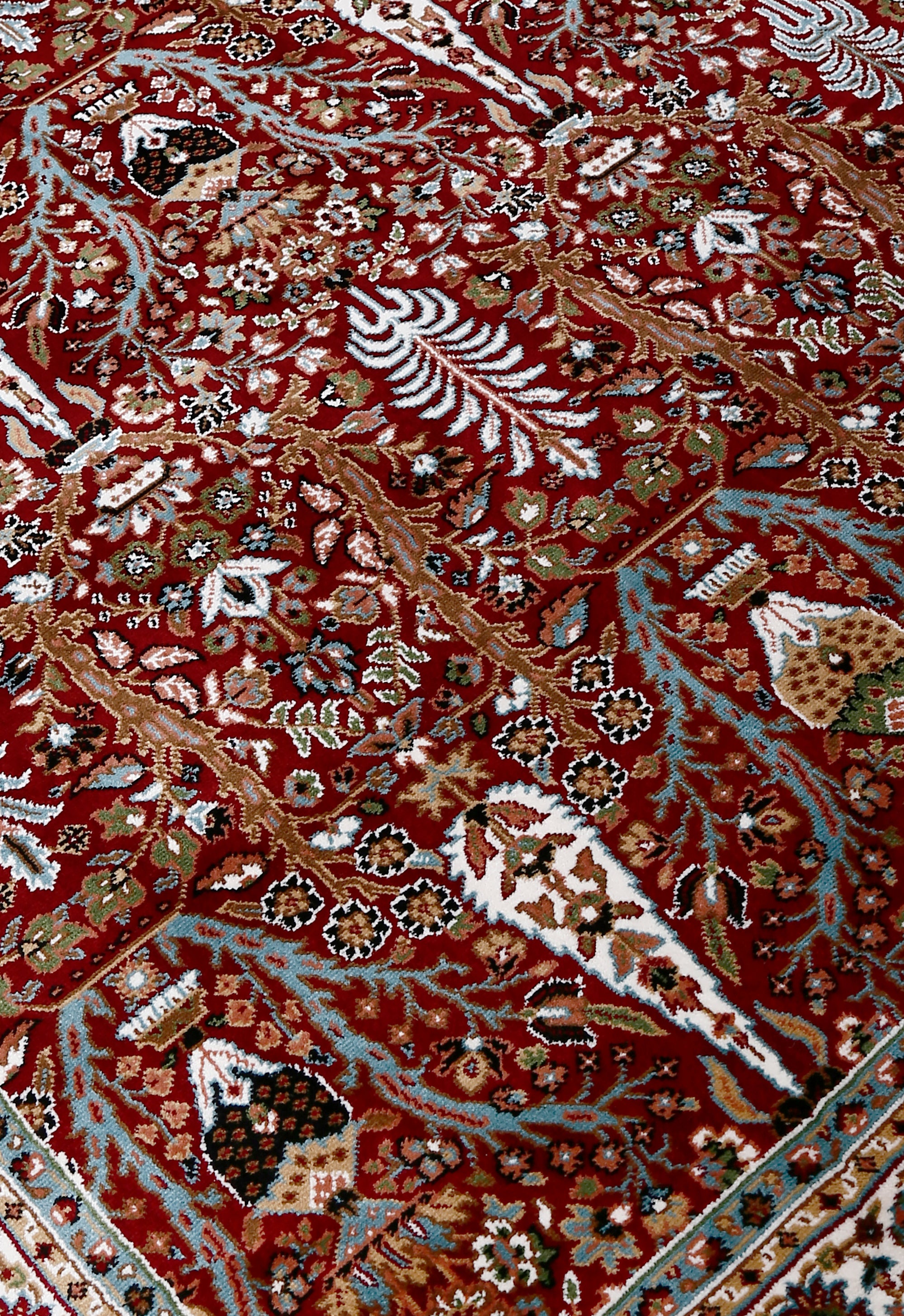 Close-up texture of Red Machine Woven Classic Art Silk Rug showing detailed Tree of Life and floral motifs