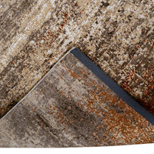 Hand-finished edge and textured abstract surface of the Rust Horizon hand knotted modern rug