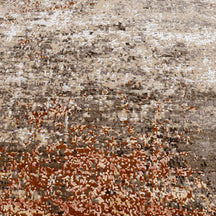 Close-up of the hand knotted wool and viscose texture with beige taupe ivory and rust abstract detailing