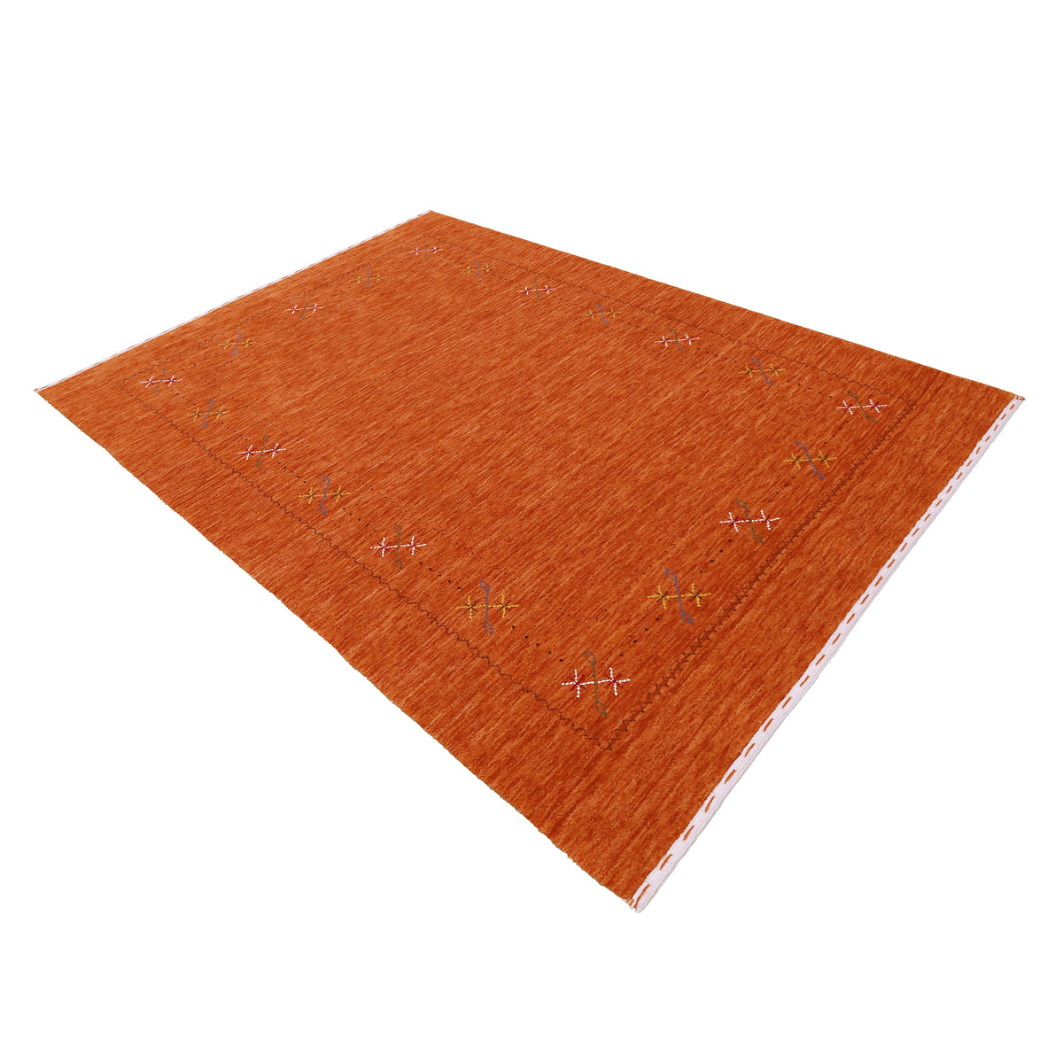 Side angle view of rust orange Hand Woven Loom Lori wool rug highlighting natural wool texture, minimal floral pattern and handmade finish