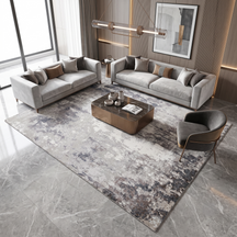 Silver ash abstract hand knotted wool and viscose rug displayed in a modern neutral living room