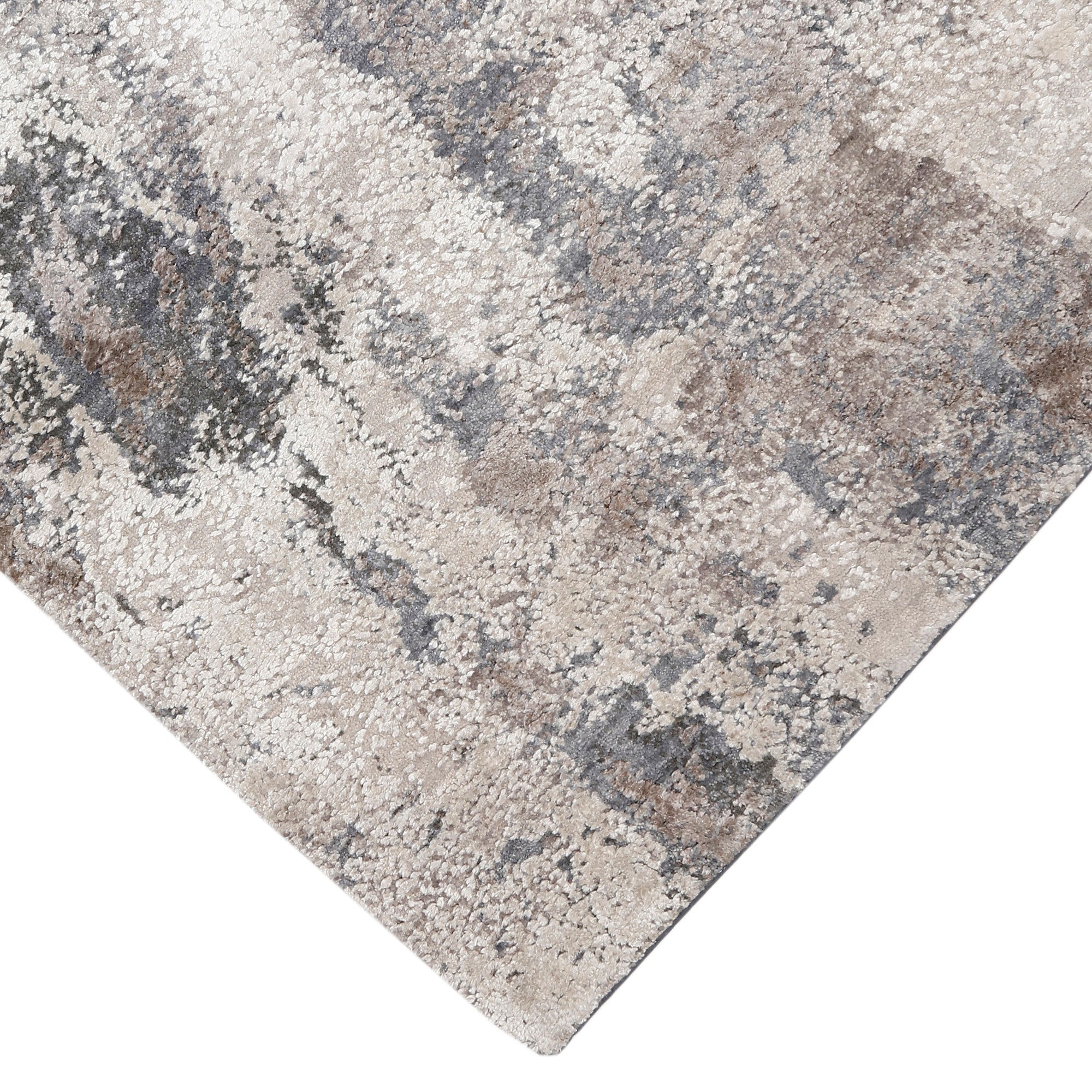 Hand-finished edge and textured abstract surface of the Silver Mist hand knotted modern rug